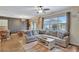 Open concept living room with sectional sofa and views to kitchen and dining area at 8710 Hinsdale Heights Dr, Polk City, FL 33868