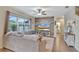 Spacious living room showcases a cozy sectional sofa and a large TV at 8710 Hinsdale Heights Dr, Polk City, FL 33868