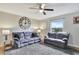 Spacious living room with comfy couches and a large TV at 8710 Hinsdale Heights Dr, Polk City, FL 33868