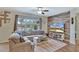 Relaxing living room with a comfortable sectional sofa, and large window at 8710 Hinsdale Heights Dr, Polk City, FL 33868