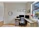 Bright home office features a corner desk, two monitors, and natural light at 8710 Hinsdale Heights Dr, Polk City, FL 33868