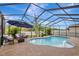 Screened-in pool area with patio furniture and fountain at 8710 Hinsdale Heights Dr, Polk City, FL 33868