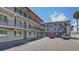 Two-story building with balconies and parking area at 900 S Peninsula Dr # 102, Daytona Beach, FL 32118