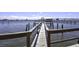 Wooden walkway over water leading to a pier at 900 S Peninsula Dr # 102, Daytona Beach, FL 32118