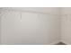 A walk-in closet with white shelving and neutral carpet at 6201 Sw 97Th St, Ocala, FL 34476