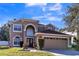 Two-story house with a two-car garage and manicured lawn at 2753 Joseph Cir, Oviedo, FL 32765