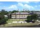 Aerial view of waterfront apartment building with green space at 411 N Halifax Ave # 104, Daytona Beach, FL 32118