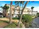 Waterfront building exterior with landscaping and balconies at 411 N Halifax Ave # 104, Daytona Beach, FL 32118
