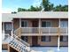 Two-story building exterior with stairs and balconies at 411 N Halifax Ave # 104, Daytona Beach, FL 32118
