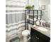 Bathroom with shower tub combo and updated vanity at 5450 Sunshine Dr, Wildwood, FL 34785