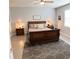 Primary bedroom with a comfortable sleigh bed and neutral decor at 5450 Sunshine Dr, Wildwood, FL 34785