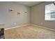 Spacious bedroom with neutral walls and plush carpeting at 5450 Sunshine Dr, Wildwood, FL 34785