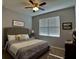 Guest bedroom with neutral decor and plenty of natural light at 5450 Sunshine Dr, Wildwood, FL 34785