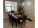 Dining area with wooden table and chairs, and a patriotic centerpiece at 5450 Sunshine Dr, Wildwood, FL 34785