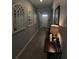 Bright hallway with tile flooring and decorative mirrors at 5450 Sunshine Dr, Wildwood, FL 34785