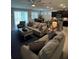 Open concept living room, kitchen, and dining area with lots of natural light at 5450 Sunshine Dr, Wildwood, FL 34785