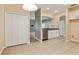 Bright dining area adjacent to kitchen featuring neutral tile flooring and natural light at 4026 Navigator Way, Kissimmee, FL 34746
