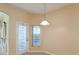 Eat-in kitchen area with sliding glass doors leading to pool and lanai at 4026 Navigator Way, Kissimmee, FL 34746