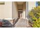 Charming home entry featuring a decorative brick walkway and lush landscaping at 4026 Navigator Way, Kissimmee, FL 34746