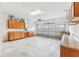 Spacious garage with storage cabinets and clean, finished concrete flooring at 4026 Navigator Way, Kissimmee, FL 34746