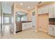 Open kitchen with stainless steel appliances, granite countertops, and tile flooring at 4026 Navigator Way, Kissimmee, FL 34746