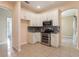 Well-designed kitchen with white cabinetry, stainless steel appliances, and tile floors at 4026 Navigator Way, Kissimmee, FL 34746