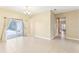 Bright, open living room with tile floors and sliding doors to the patio at 4026 Navigator Way, Kissimmee, FL 34746