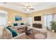 Staged living room with neutral walls, ceiling fan, and comfortable seating area at 4026 Navigator Way, Kissimmee, FL 34746