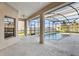 A screened-in pool and patio with views of the backyard and a cozy outdoor retreat at 4026 Navigator Way, Kissimmee, FL 34746