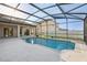 Screened-in pool with ample deck space is perfect for relaxation and entertaining at 4026 Navigator Way, Kissimmee, FL 34746