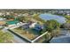 Aerial view of house near lake and community at 213 Aidans Ldg, Haines City, FL 33844
