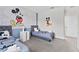 Mickey Mouse themed bedroom with twin beds, nightstands, and ample closet space at 213 Aidans Ldg, Haines City, FL 33844