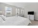 Comfortable bedroom with a king-size bed and large windows at 213 Aidans Ldg, Haines City, FL 33844