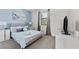 Cozy bedroom with a queen-size bed and light blue walls at 213 Aidans Ldg, Haines City, FL 33844