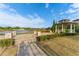 Landscaped community area with gazebo and pond at 213 Aidans Ldg, Haines City, FL 33844