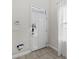 Modern white front door with keypad entry at 213 Aidans Ldg, Haines City, FL 33844