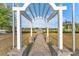 Community gazebo near pond with walkway at 213 Aidans Ldg, Haines City, FL 33844