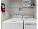Convenient laundry room with washer, dryer, and shelving at 213 Aidans Ldg, Haines City, FL 33844