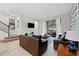 Spacious living room with leather sofas and access to backyard at 213 Aidans Ldg, Haines City, FL 33844