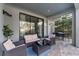 Covered patio with seating area, adjacent to the pool at 213 Aidans Ldg, Haines City, FL 33844