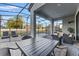 Outdoor patio with pool, seating area, and screened enclosure at 213 Aidans Ldg, Haines City, FL 33844