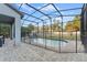 Screened-in pool with safety fence and ample deck space at 213 Aidans Ldg, Haines City, FL 33844