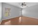 Spacious bedroom with wood flooring and ceiling fan at 10555 Leader Ln, Orlando, FL 32825