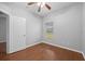 Spacious bedroom with wood floors and ceiling fan at 10555 Leader Ln, Orlando, FL 32825