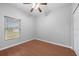 Bright bedroom with wood floors and ceiling fan at 10555 Leader Ln, Orlando, FL 32825
