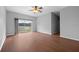 Living room with hardwood floors, sliding glass doors and lake view at 10555 Leader Ln, Orlando, FL 32825