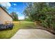 Private backyard with wooden fence and gate at 15241 Colley Dr, Tavares, FL 32778