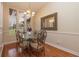 Formal dining room showcasing hardwood floors and a large mirror at 15241 Colley Dr, Tavares, FL 32778