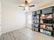 Empty bedroom with ceiling fan and shelving at 2130 Sequoia Way, Davenport, FL 33896