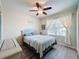 Cozy bedroom with a queen-size bed and window at 2130 Sequoia Way, Davenport, FL 33896